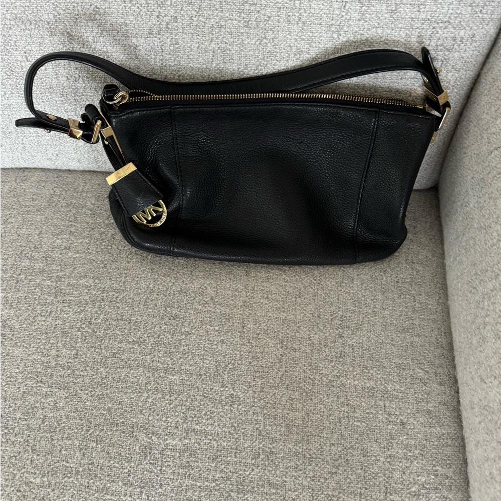 Michael Kors black soft leather. Very nice to touch smooth